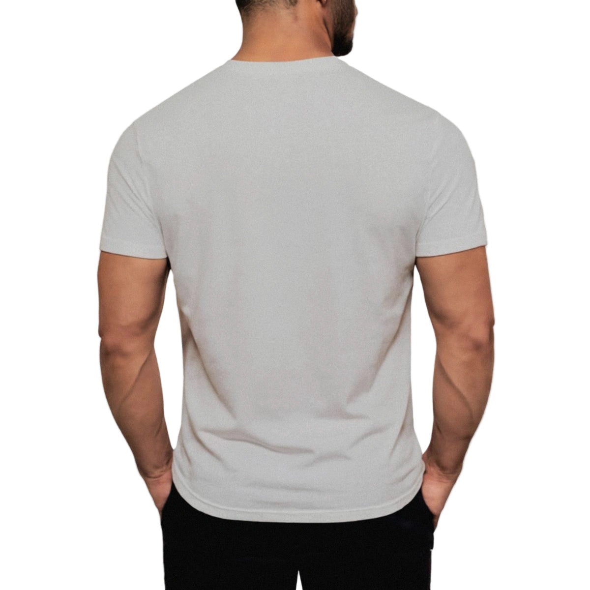 Man wearing a plain gray t-shirt on a light gray background