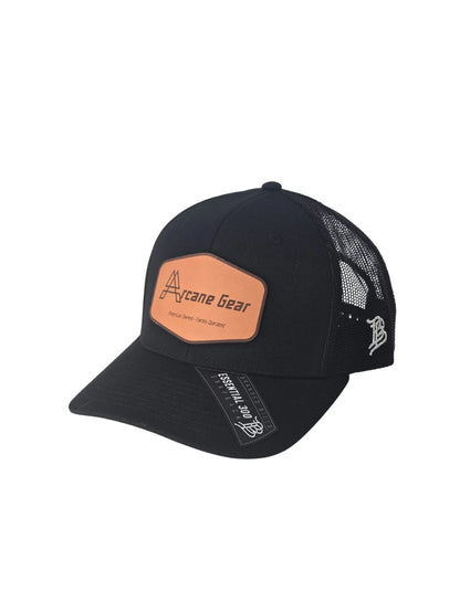 Black cap with brown leather patch and mesh back on a white background